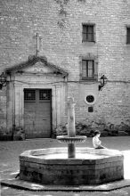 Little boy on fountain side behind the cathedral of Barcelona