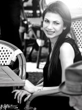 Pretty girl on terrace of Franz Kafka Café in Prague