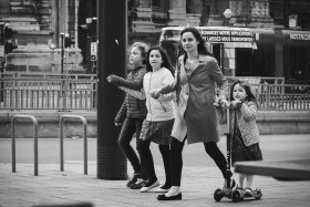 Young mother with girls in street of Brussels