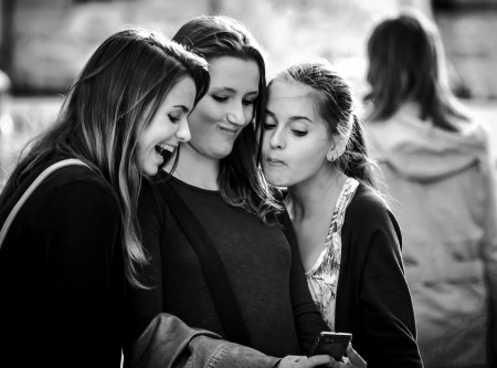 Happy girls checking their selfie, Prague